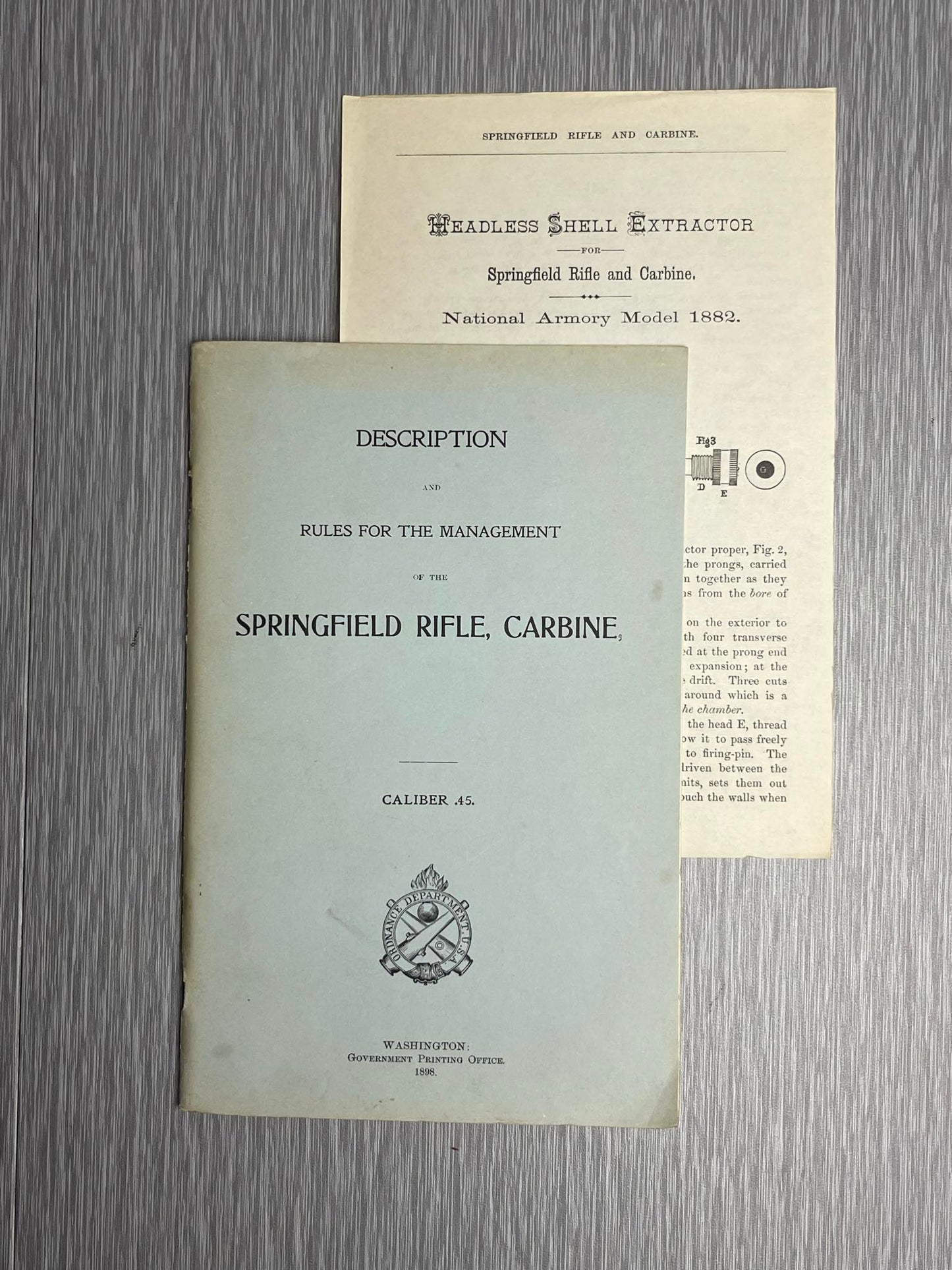 US ARMY 1898 “DESCRIPTION AND RULES FOR THE MANAGEMENT OF THE SPRINGFIELD RIFLE CARBINE CALIBER .45” BOOK W/ 1882 HEADLESS SHELL EXTRACTOR MANUAL