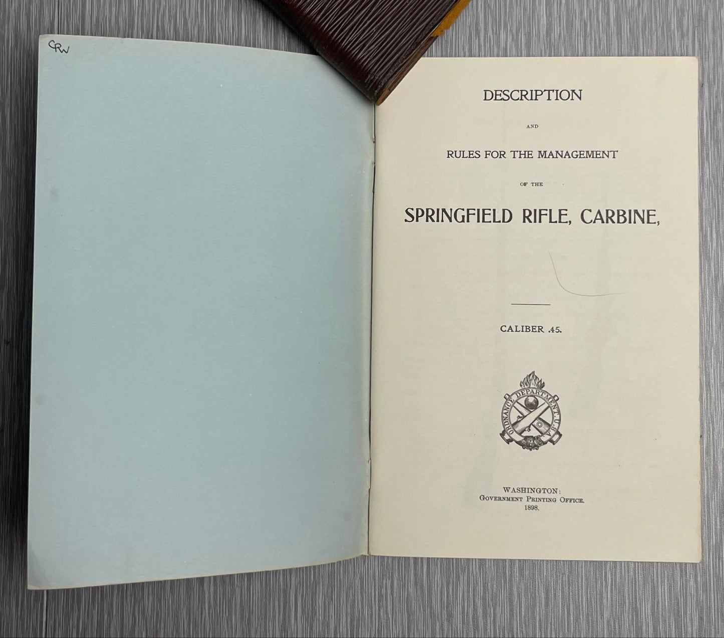 US ARMY 1898 “DESCRIPTION AND RULES FOR THE MANAGEMENT OF THE SPRINGFIELD RIFLE CARBINE CALIBER .45” BOOK W/ 1882 HEADLESS SHELL EXTRACTOR MANUAL