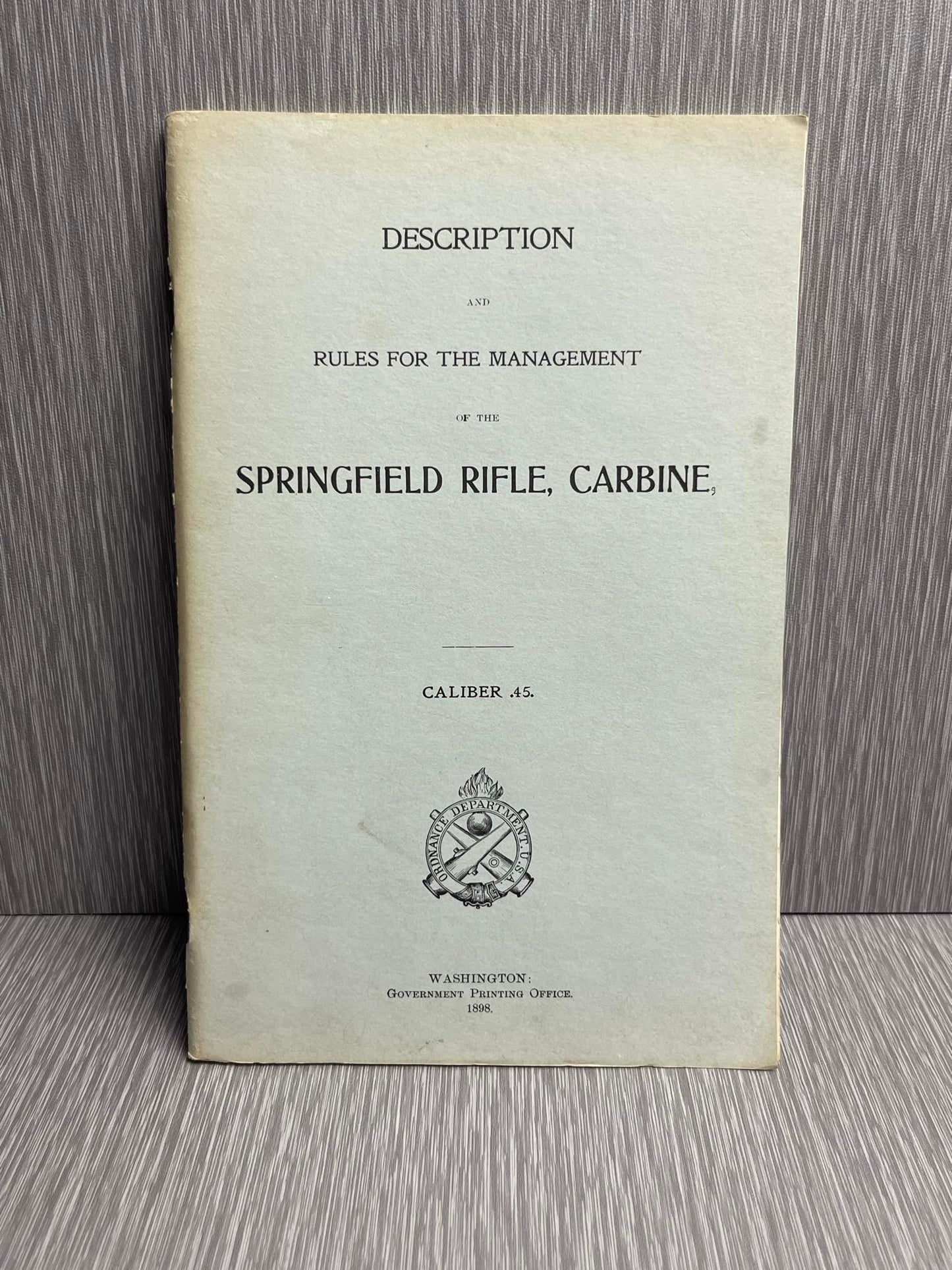 US ARMY 1898 “DESCRIPTION AND RULES FOR THE MANAGEMENT OF THE SPRINGFIELD RIFLE CARBINE CALIBER .45” BOOK W/ 1882 HEADLESS SHELL EXTRACTOR MANUAL